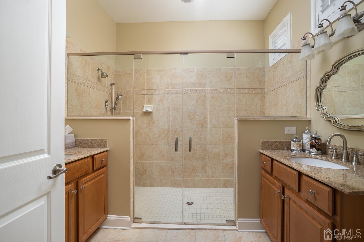 93 Timber Hill Drive Monroe Township, NJ 08831 - Photo 22 of 40 a bathroom with a granite countertop shower sink and mirror