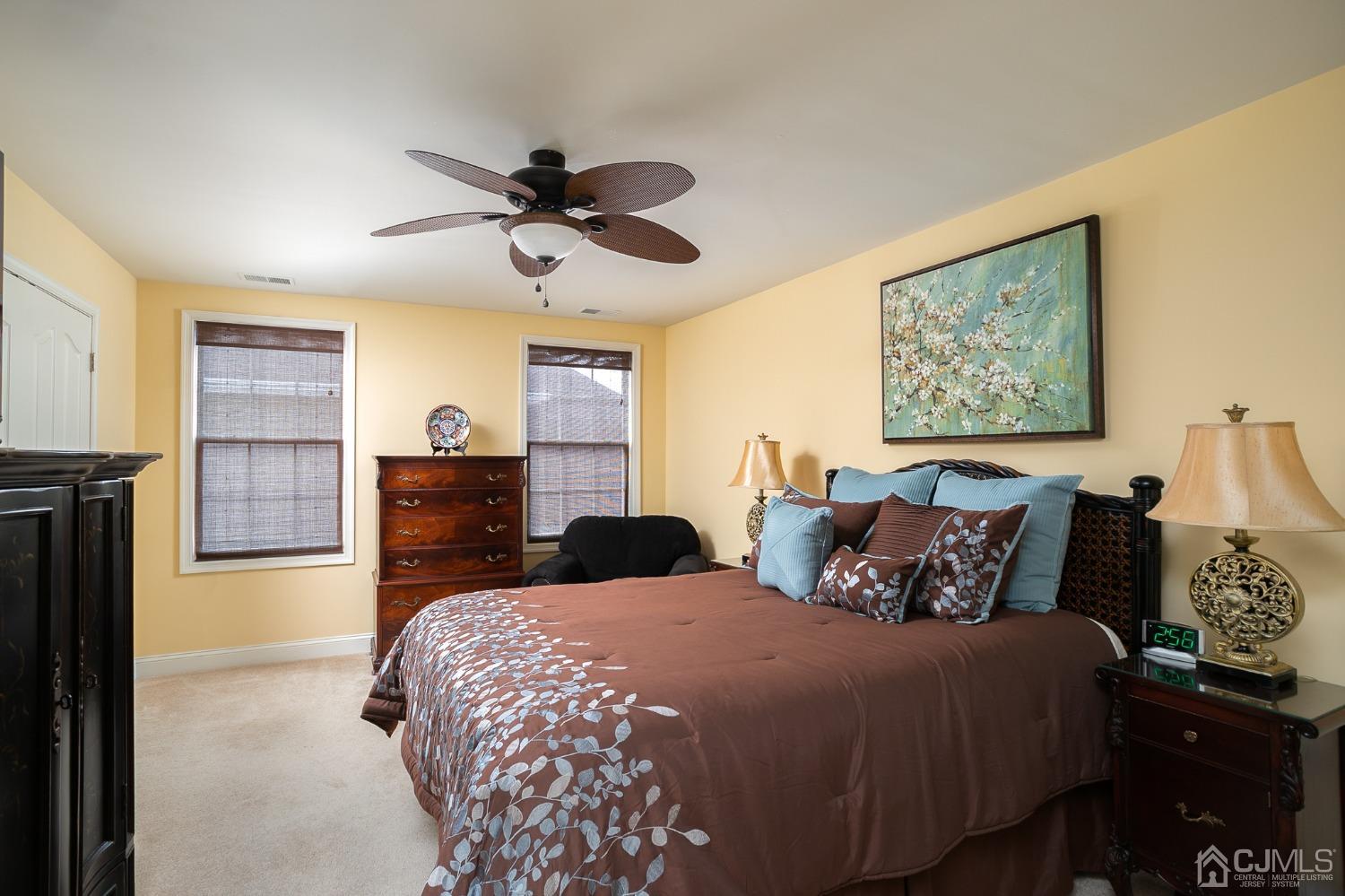 93 Timber Hill Drive Monroe Township, NJ 08831 - Photo 24 of 40 a bedroom with a bed and wooden floor