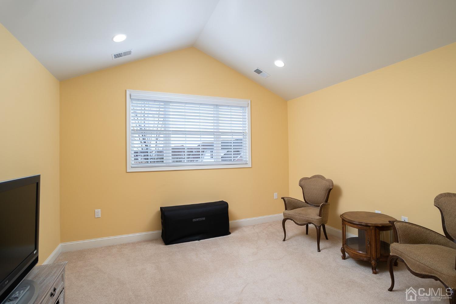 93 Timber Hill Drive Monroe Township, NJ 08831 - Photo 26 of 40 a room with furniture and a chair