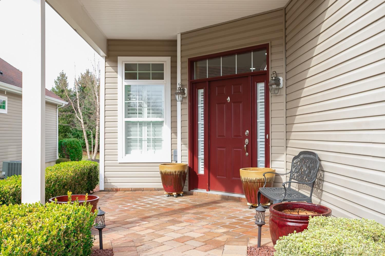 93 Timber Hill Drive Monroe Township, NJ 08831 - Photo 30 of 40 a view of a porch with chairs and a potted plant
