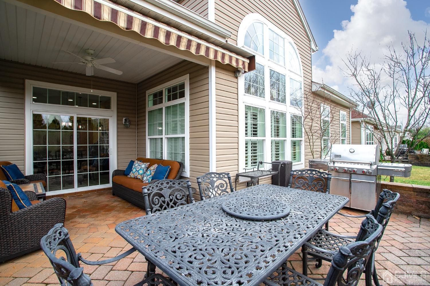93 Timber Hill Drive Monroe Township, NJ 08831 - Photo 33 of 40 a view of a dining table and chairs in the patio