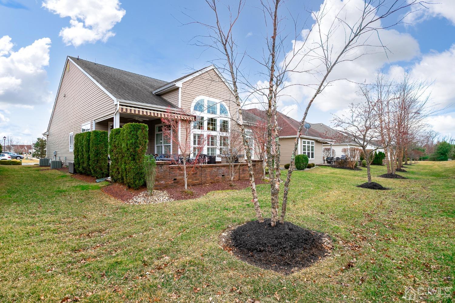 93 Timber Hill Drive Monroe Township, NJ 08831 - Photo 37 of 40 a front view of a house with a yard