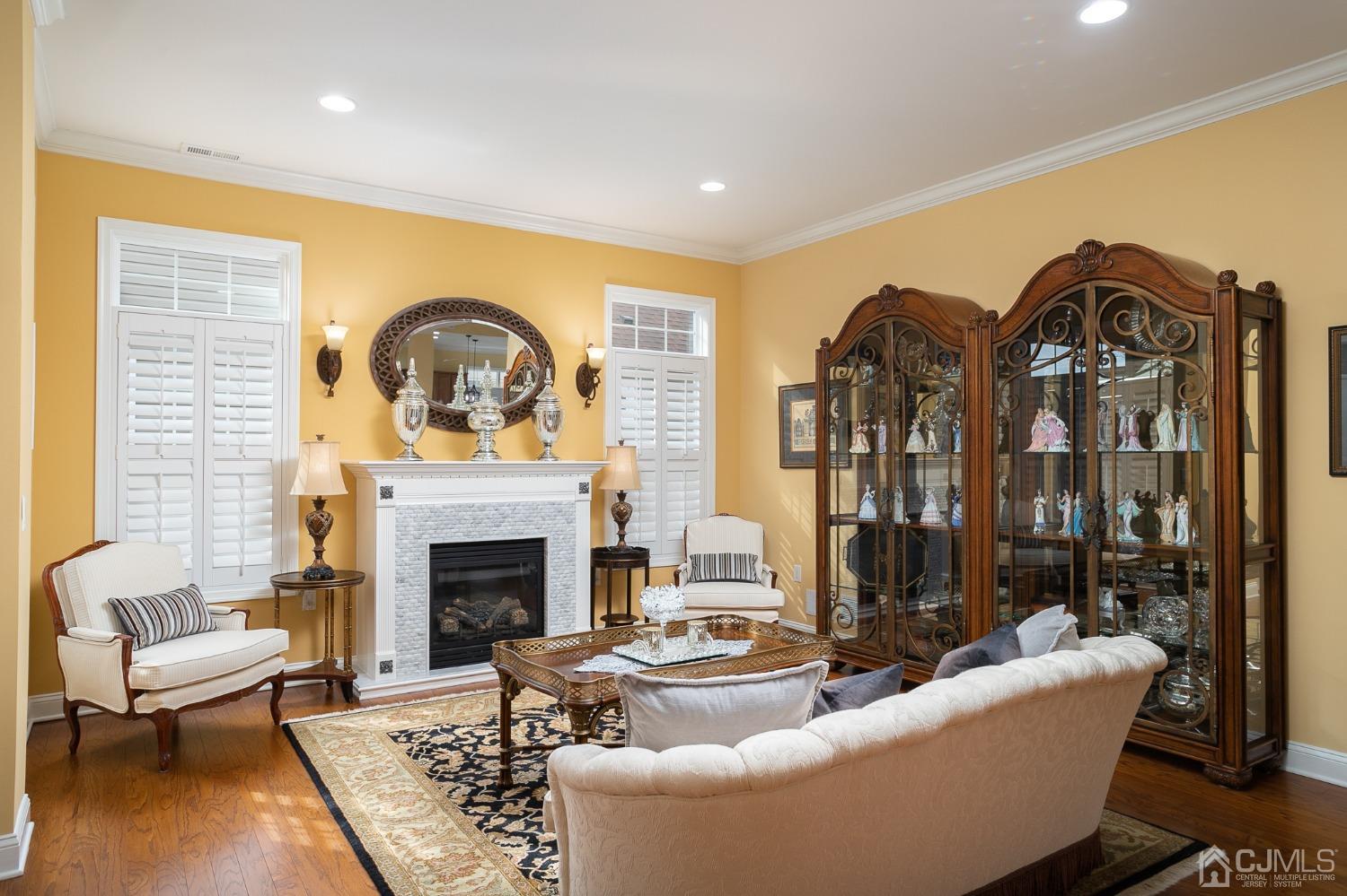 93 Timber Hill Drive Monroe Township, NJ 08831 - Photo 7 of 40 a living room with fireplace furniture and a fireplace