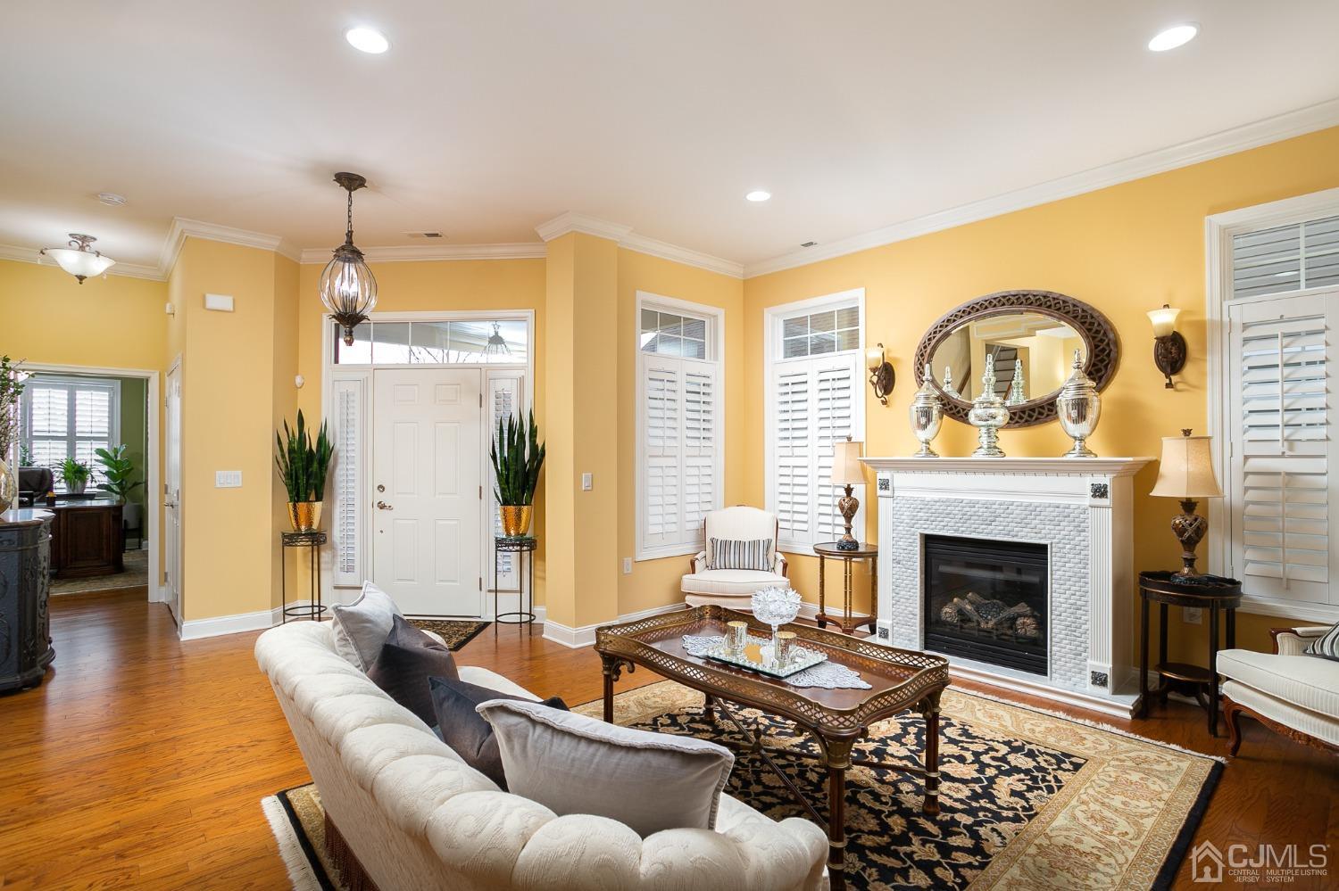 93 Timber Hill Drive Monroe Township, NJ 08831 - Photo 8 of 40 a living room with furniture fireplace and wooden floor