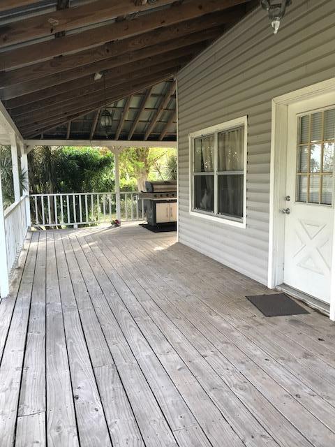2245 Bacom Point Road Pahokee, FL 33476 - Photo 15 of 24 Front Home Wrap Around Porch