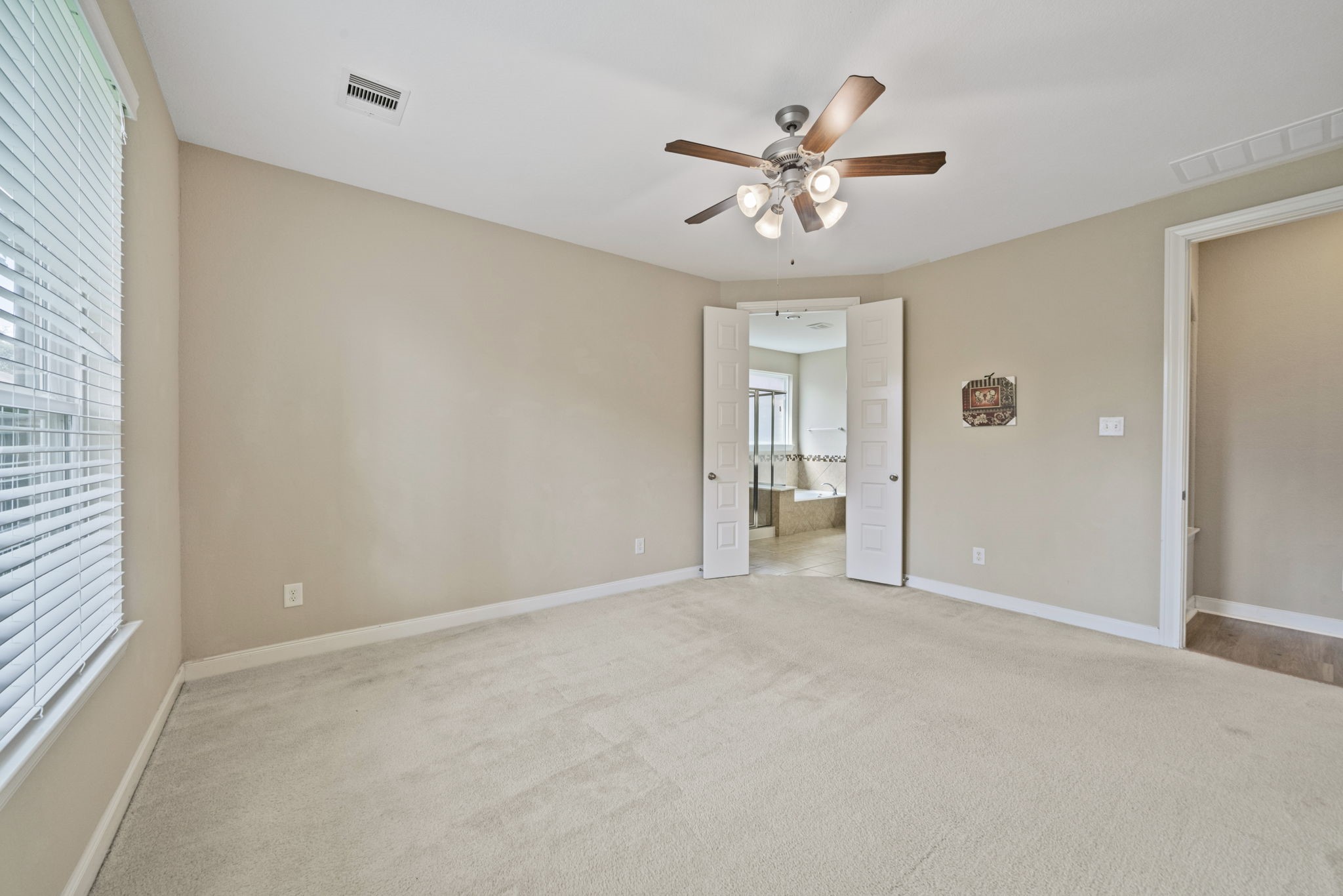 22523 Birch Ridge Meadow Drive Spring, TX 77389 - Photo 19 of 39 a view of an empty room with chandelier fan