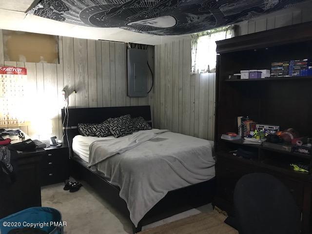 233 Shiffer Road Stroudsburg, PA 18360 - Photo 11 of 20 a bedroom with a bed and a night stand