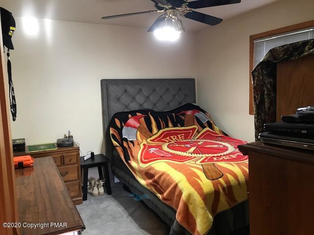 233 Shiffer Road Stroudsburg, PA 18360 - Photo 12 of 20 a bedroom with a bed and a flat screen tv
