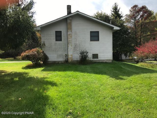 233 Shiffer Road Stroudsburg, PA 18360 - Photo 3 of 20 a view of a house with yard and a garden