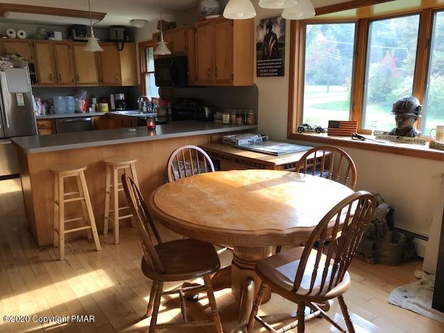 233 Shiffer Road Stroudsburg, PA 18360 - Photo 7 of 20 a view of a dining room with furniture window and outside view