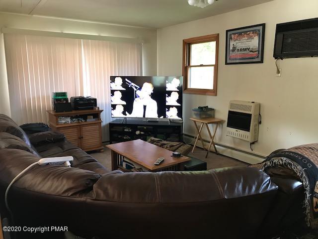 233 Shiffer Road Stroudsburg, PA 18360 - Photo 9 of 20 a living room with furniture and a flat screen tv