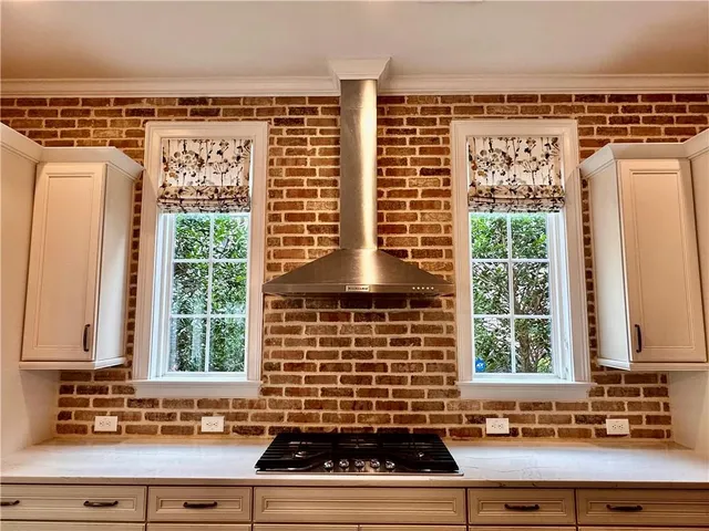 a view of a sink and a window