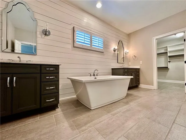 a view of kitchen with stainless steel appliances a sink and cabinets