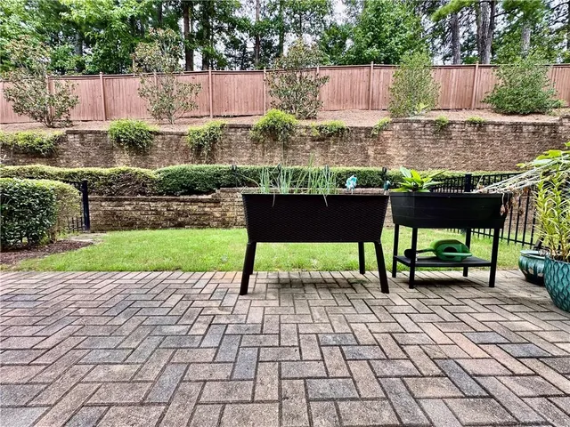 a view of a backyard with sitting area