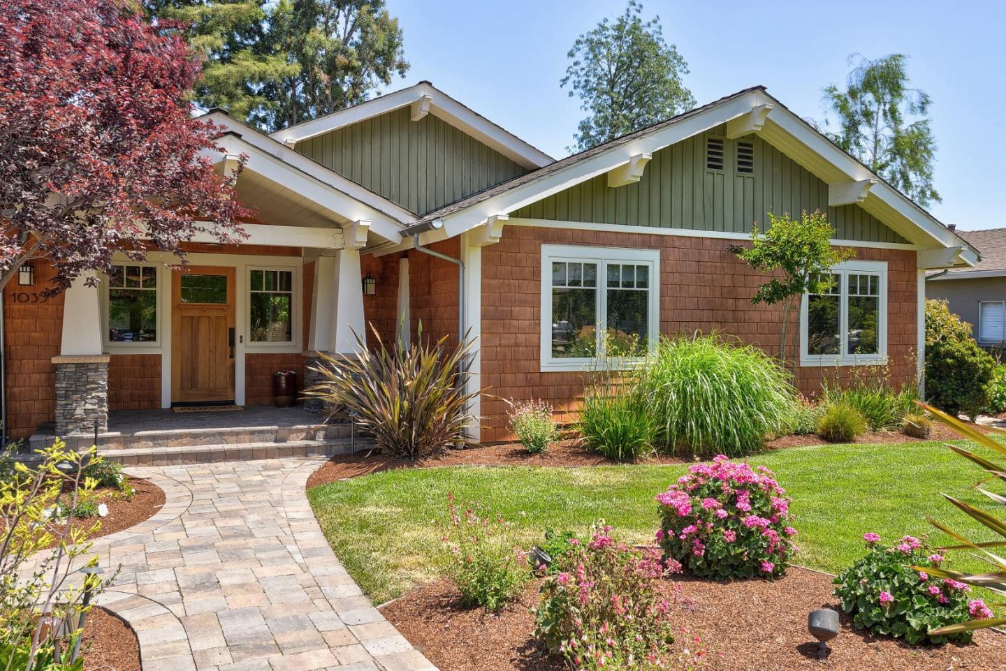 1035 Rilma Lane Los Altos, CA 94022 - Photo 2 of 41 a front view of a house with a yard