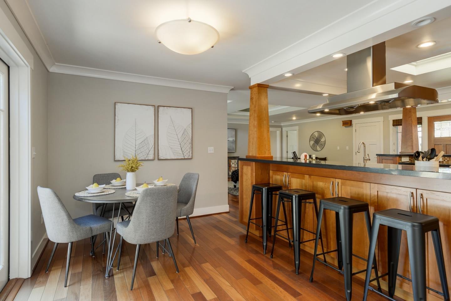 1035 Rilma Lane Los Altos, CA 94022 - Photo 15 of 41 a dining room with furniture a chandelier and wooden floor