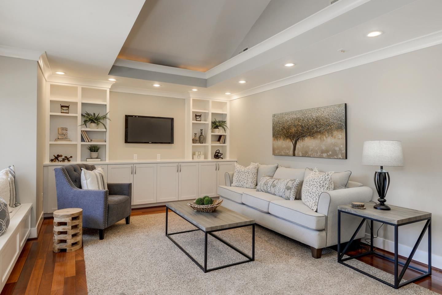 1035 Rilma Lane Los Altos, CA 94022 - Photo 16 of 41 a living room with furniture and a flat screen tv