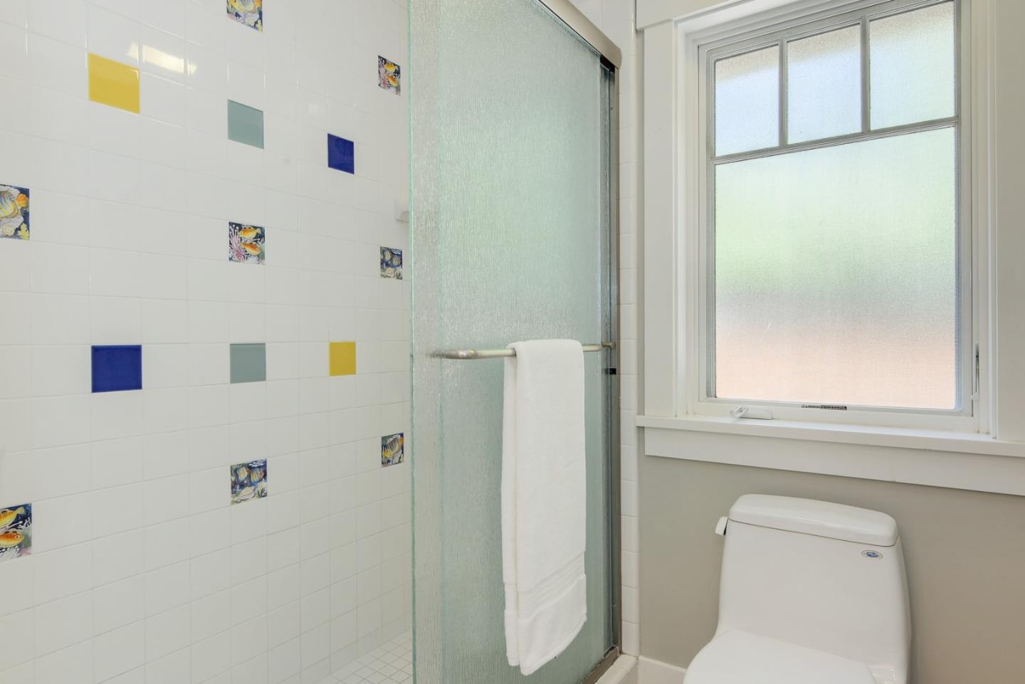 1035 Rilma Lane Los Altos, CA 94022 - Photo 20 of 41 a bathroom with a shower and a toilet