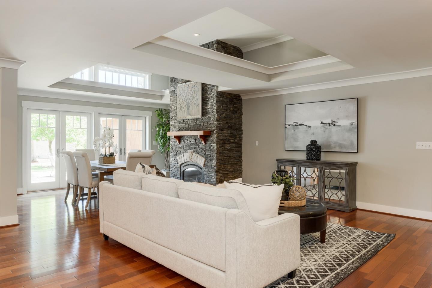 1035 Rilma Lane Los Altos, CA 94022 - Photo 3 of 41 a living room with furniture a fireplace and a window
