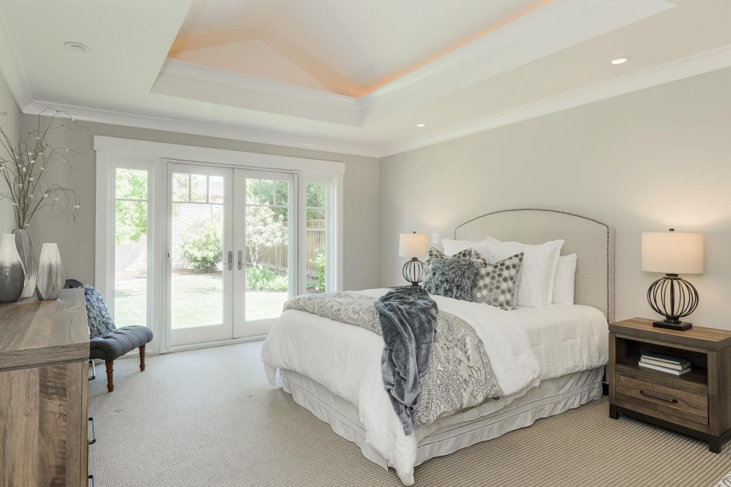 1035 Rilma Lane Los Altos, CA 94022 - Photo 30 of 41 a bedroom with a bed a table and chair