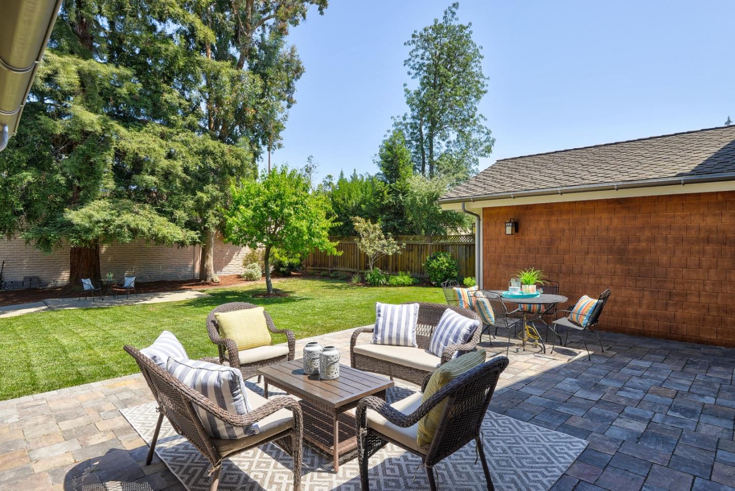 1035 Rilma Lane Los Altos, CA 94022 - Photo 32 of 41 a view of a patio with a table chairs and a fire pit