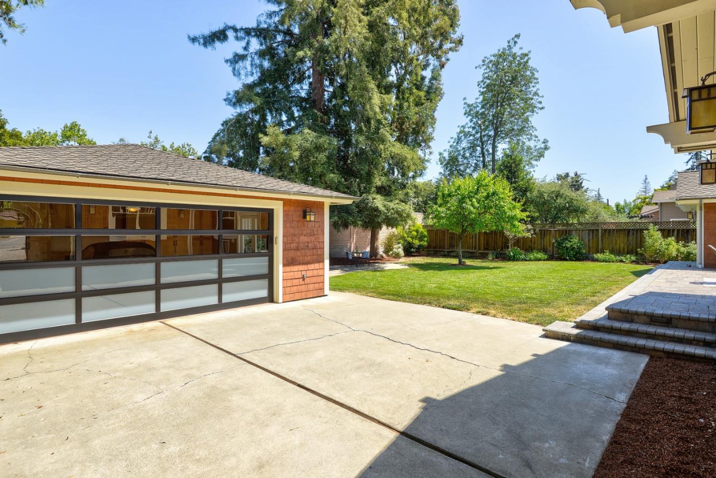 1035 Rilma Lane Los Altos, CA 94022 - Photo 33 of 41 a view of backyard with a garden and trees