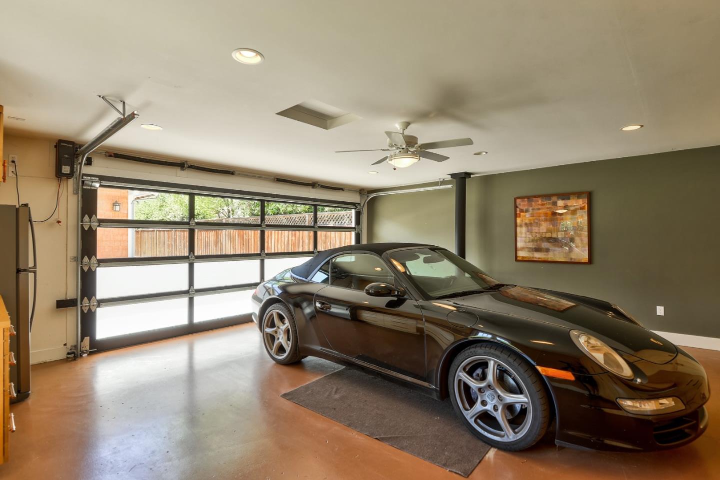 1035 Rilma Lane Los Altos, CA 94022 - Photo 35 of 41 a car is parked in a room next to a window