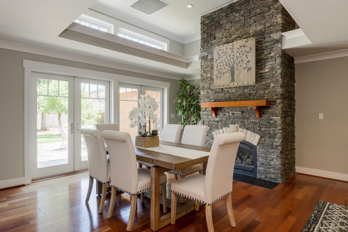 1035 Rilma Lane Los Altos, CA 94022 - Photo 7 of 41 a view of a dining room with furniture and wooden floor