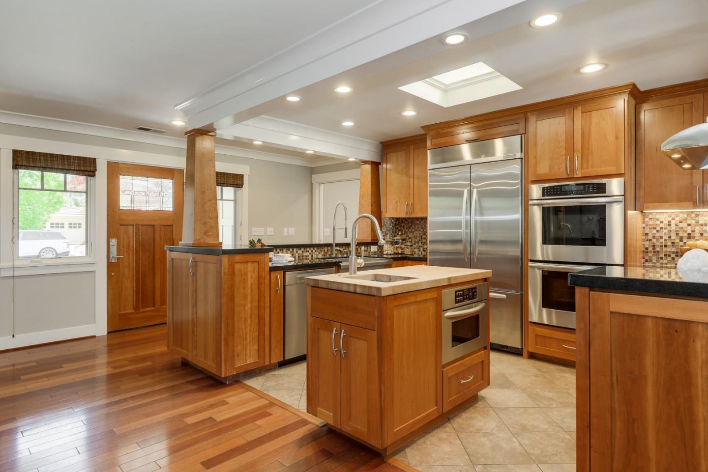 1035 Rilma Lane Los Altos, CA 94022 - Photo 8 of 41 a kitchen with stainless steel appliances granite countertop a stove a sink and a refrigerator