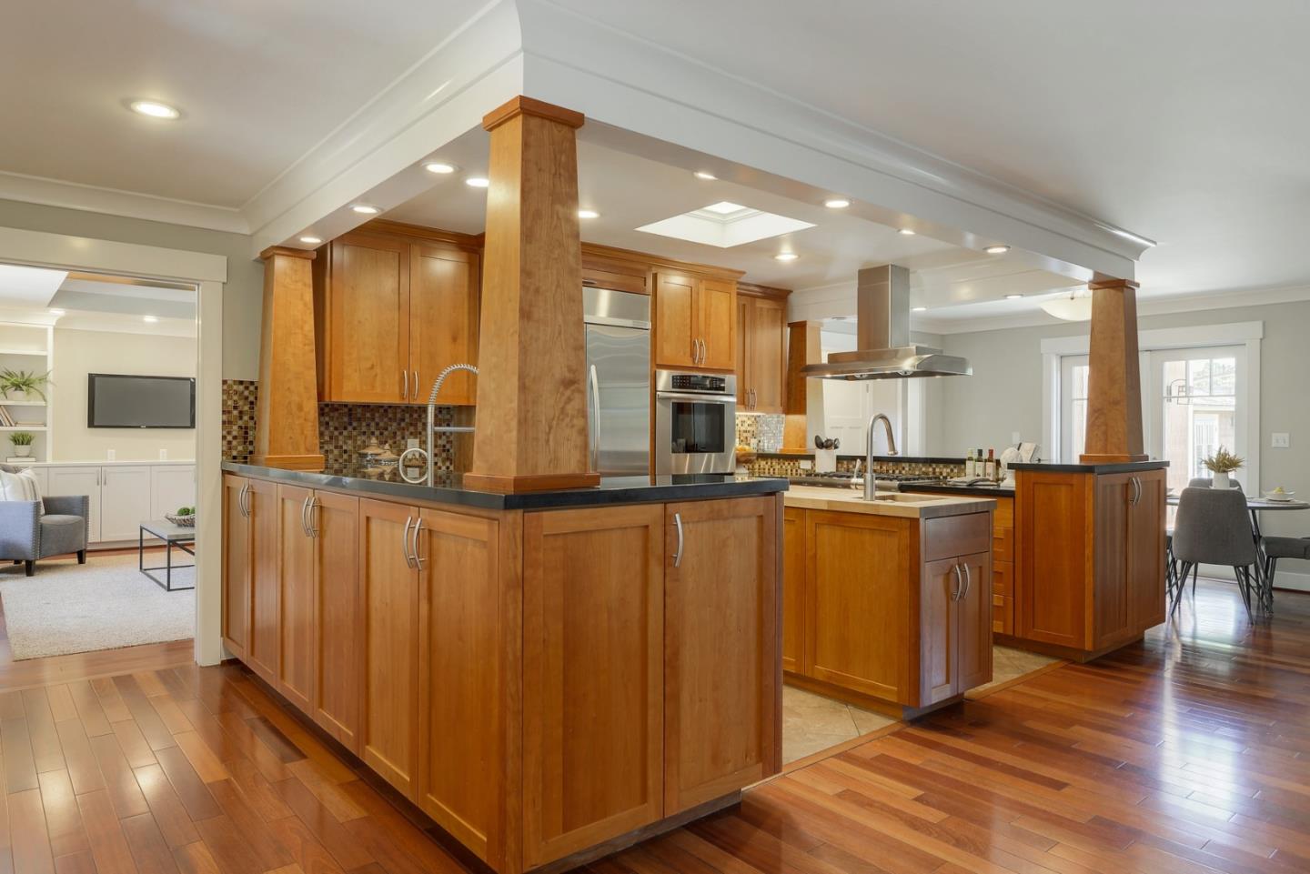 1035 Rilma Lane Los Altos, CA 94022 - Photo 10 of 41 a open kitchen with stainless steel appliances granite countertop a refrigerator a sink and a stove with wooden floor