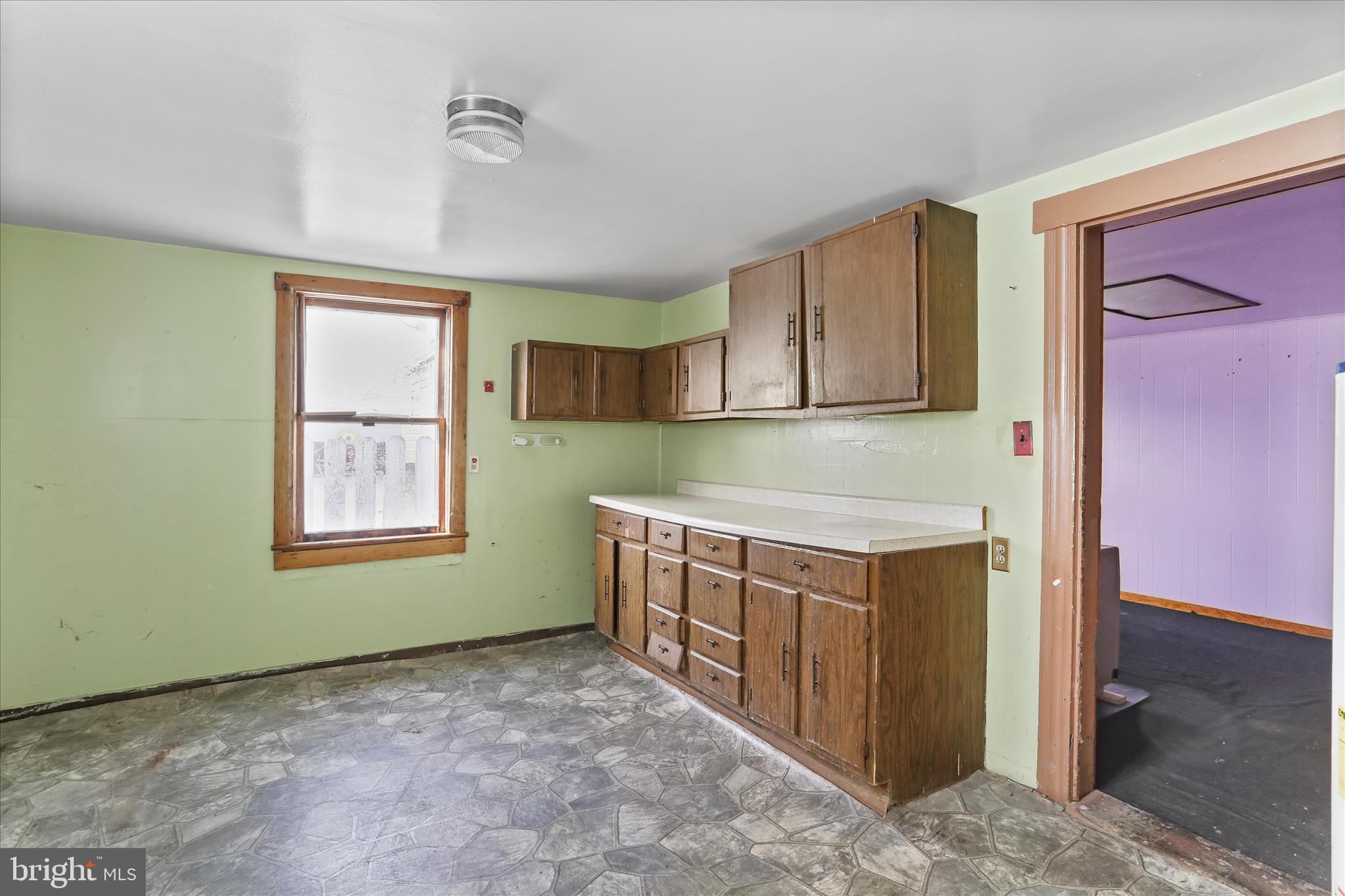 47 D Street Keyser, WV 26726 - Photo 5 of 30 a kitchen with a stove a sink and a refrigerator