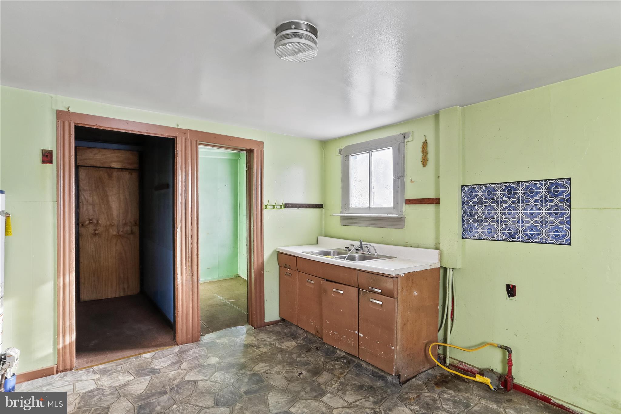 47 D Street Keyser, WV 26726 - Photo 6 of 30 a view of a bathroom with sink mirror and window