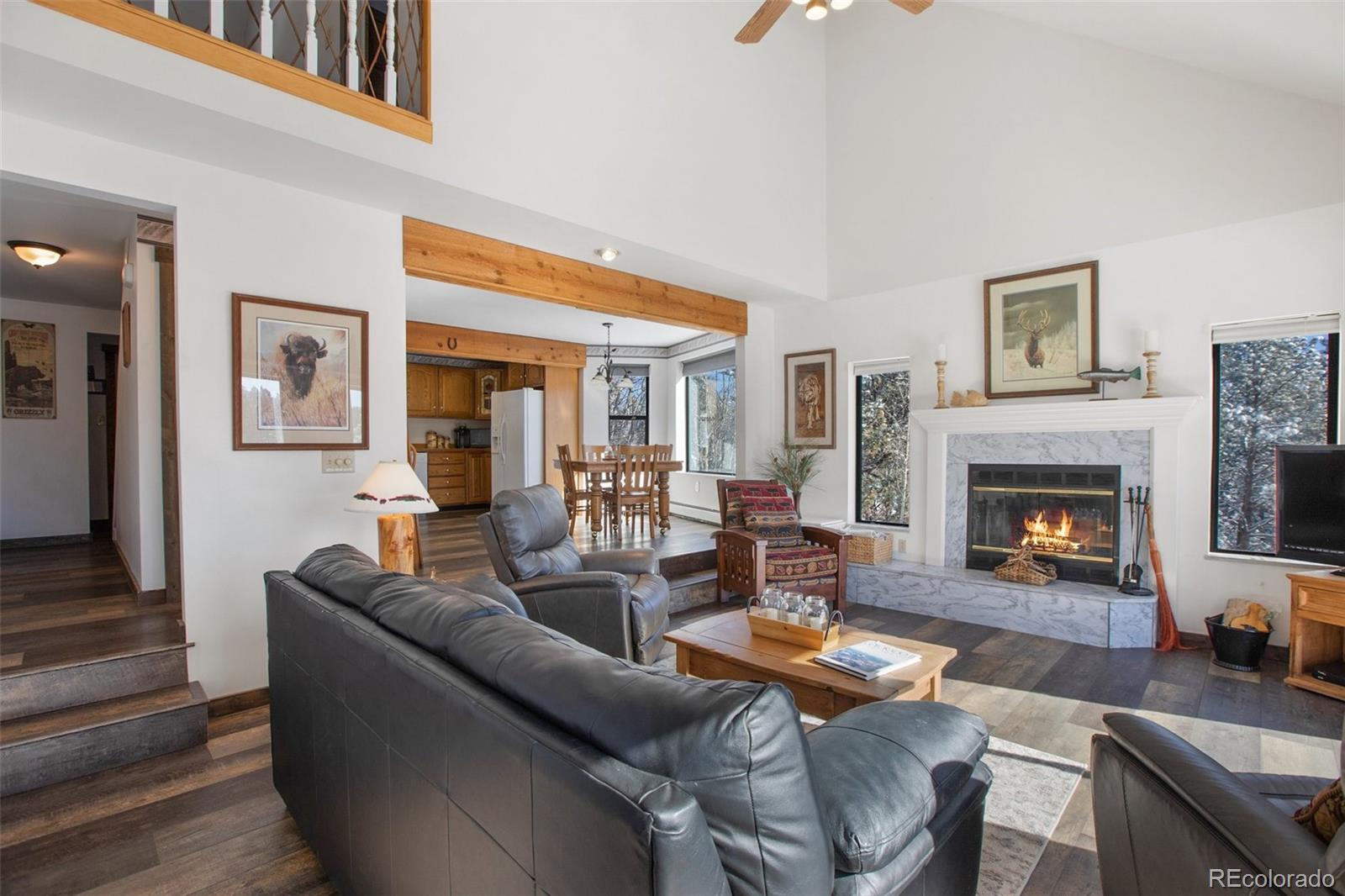 170 Ridge Road Divide, CO 80814 - Photo 13 of 50 a living room with furniture and a fireplace