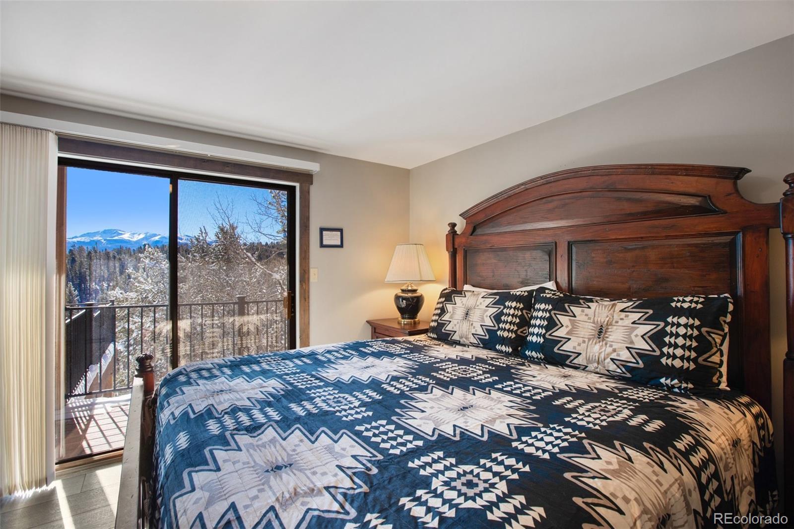 170 Ridge Road Divide, CO 80814 - Photo 19 of 50 a bedroom with a bed and a large window