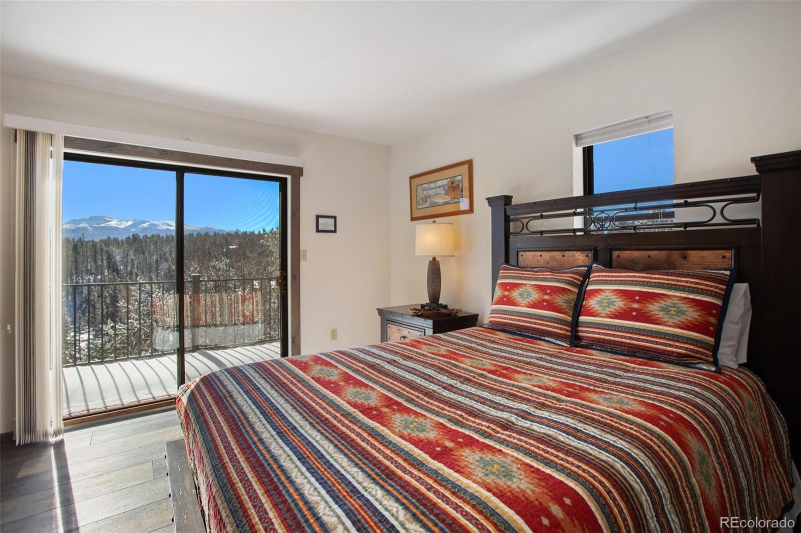 170 Ridge Road Divide, CO 80814 - Photo 25 of 50 a bedroom with a bed and a window