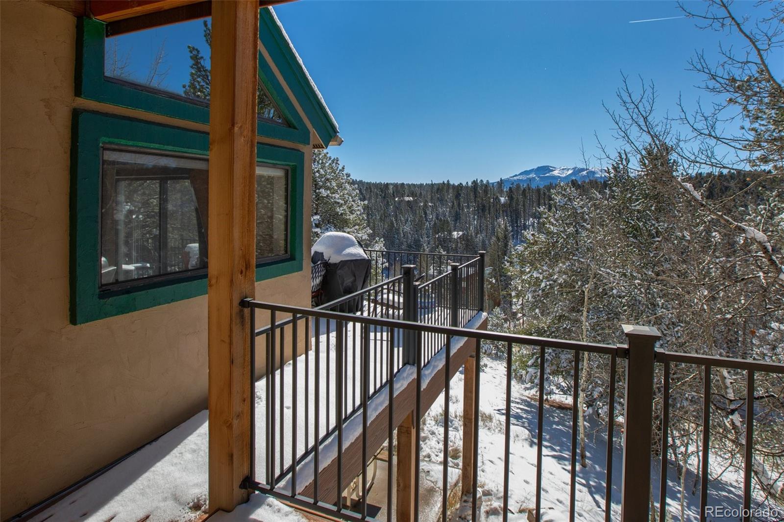 170 Ridge Road Divide, CO 80814 - Photo 28 of 50 a view of a balcony with wooden fence and floor