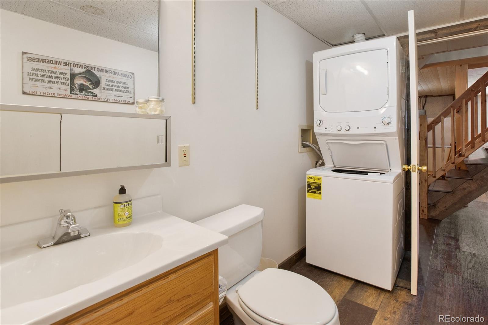 170 Ridge Road Divide, CO 80814 - Photo 36 of 50 a bathroom with a sink a toilet and a mirror