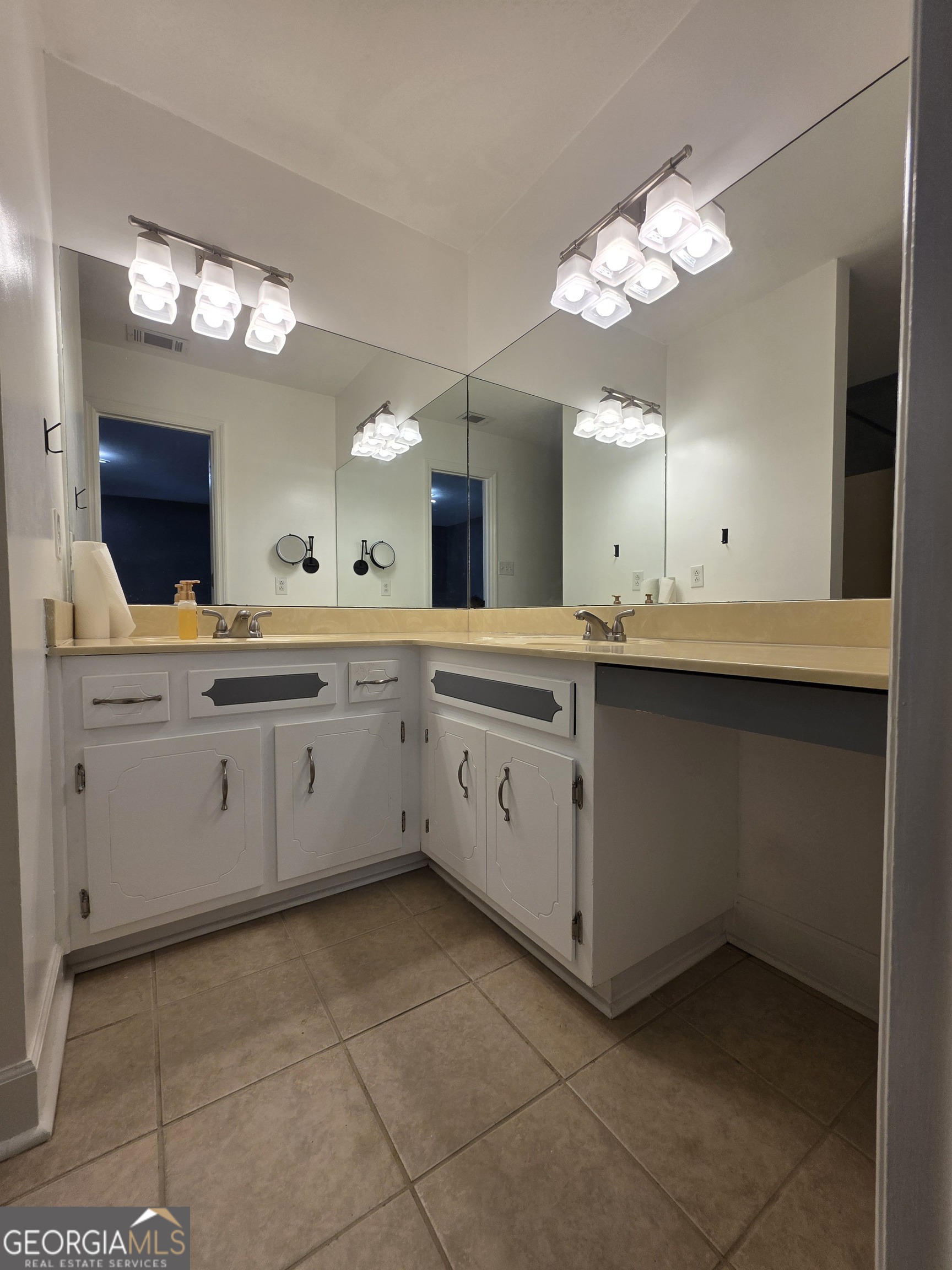 110 Maggie Court Leesburg, GA 31763 - Photo 26 of 64 a large white kitchen with a sink a large mirror and cabinets