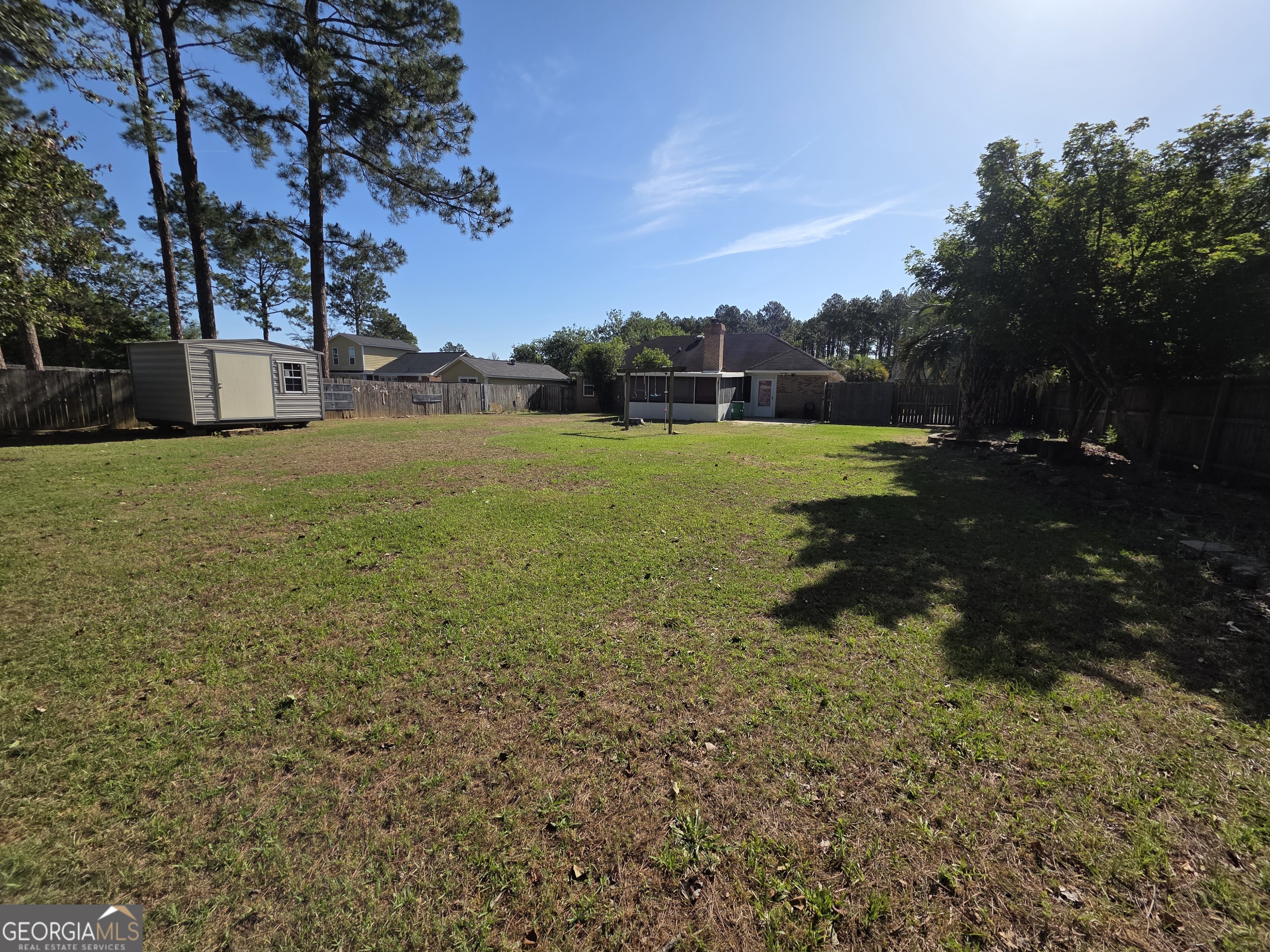 110 Maggie Court Leesburg, GA 31763 - Photo 31 of 64 a view of a field of grass and a building