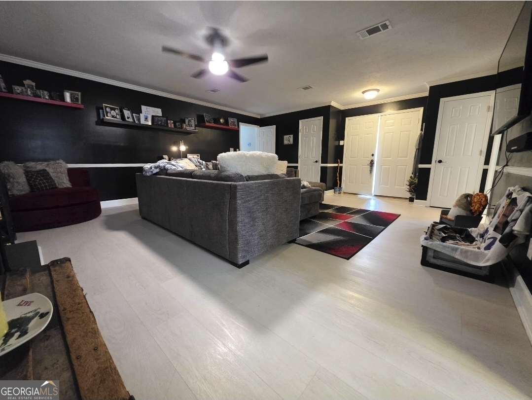 110 Maggie Court Leesburg, GA 31763 - Photo 34 of 64 a living room with furniture and a flat screen tv