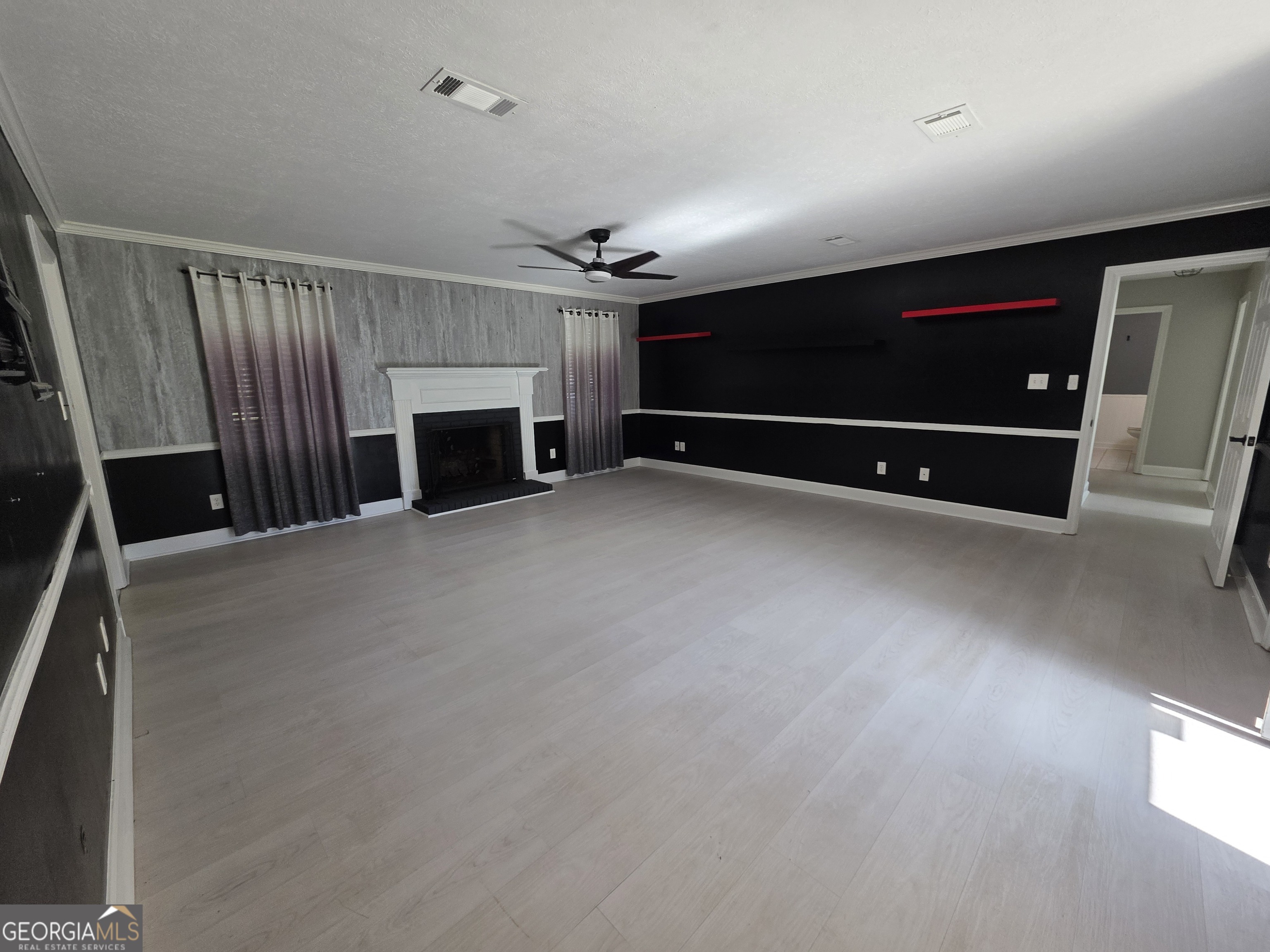 110 Maggie Court Leesburg, GA 31763 - Photo 4 of 64 a view of an empty room with a fireplace