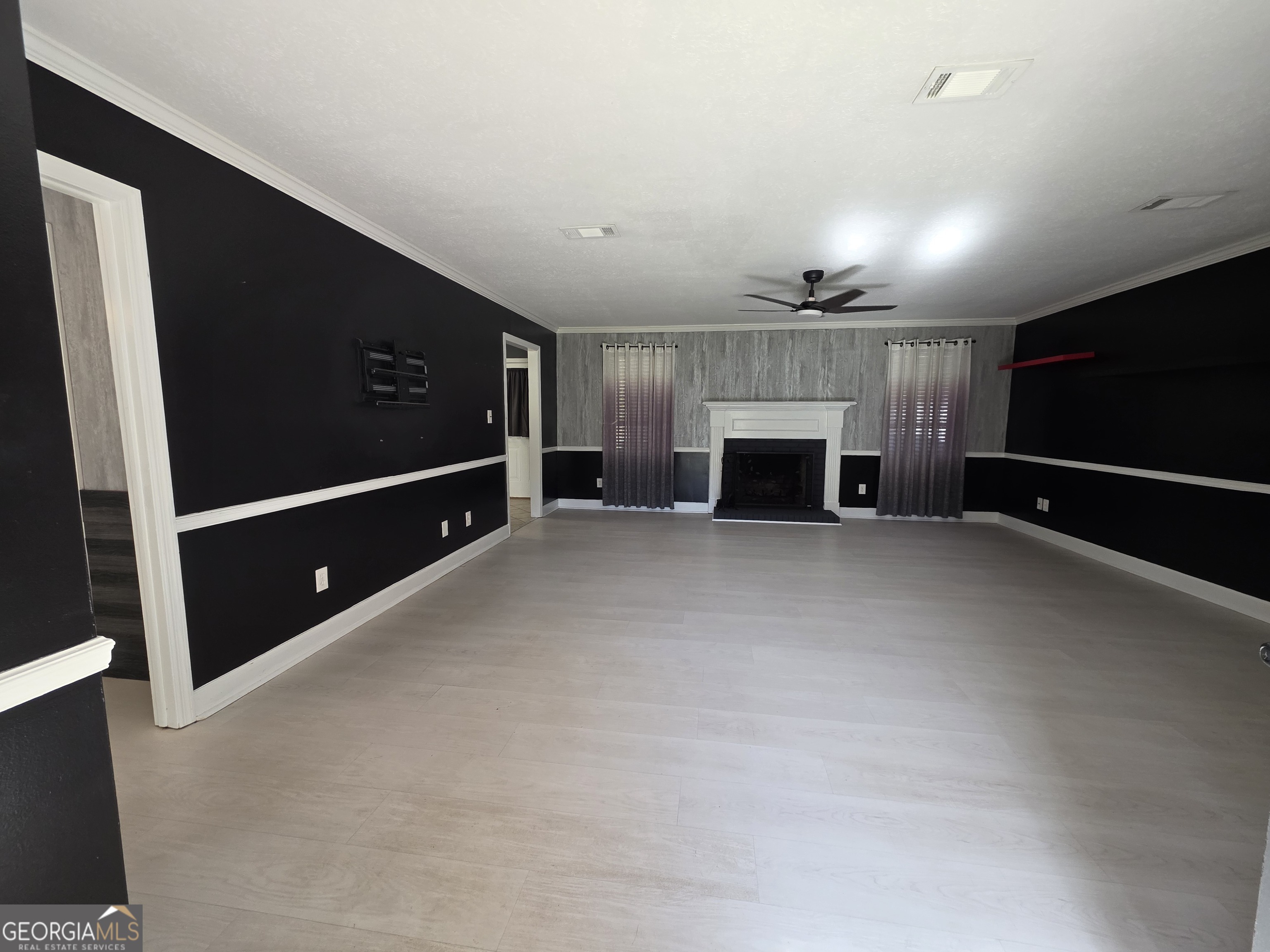 110 Maggie Court Leesburg, GA 31763 - Photo 5 of 64 a view of an empty room with a fireplace