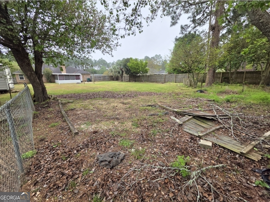 110 Maggie Court Leesburg, GA 31763 - Photo 61 of 64 a view of a yard with plants and a large tree
