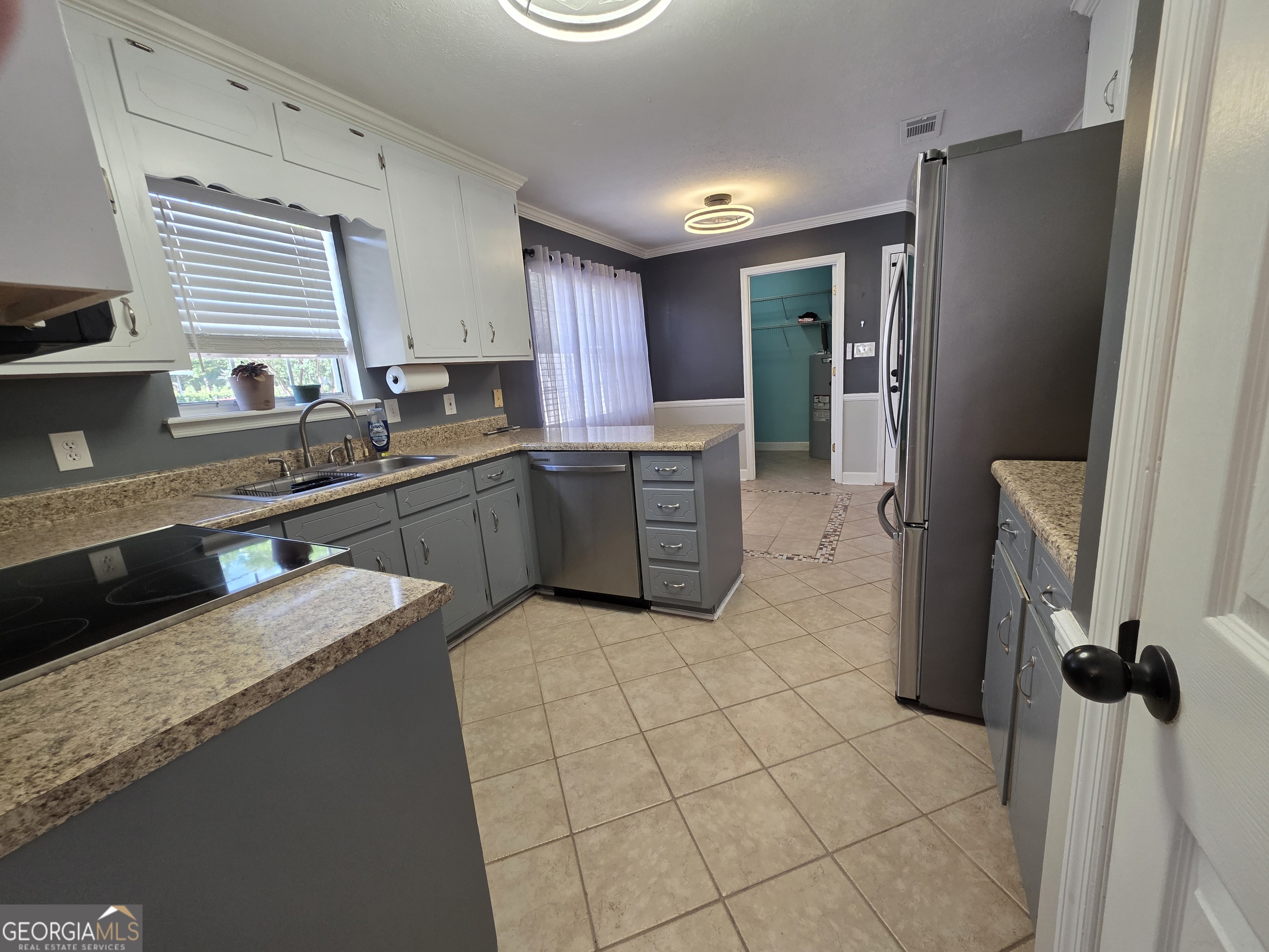 110 Maggie Court Leesburg, GA 31763 - Photo 9 of 64 a kitchen with stainless steel appliances granite countertop a refrigerator and a sink