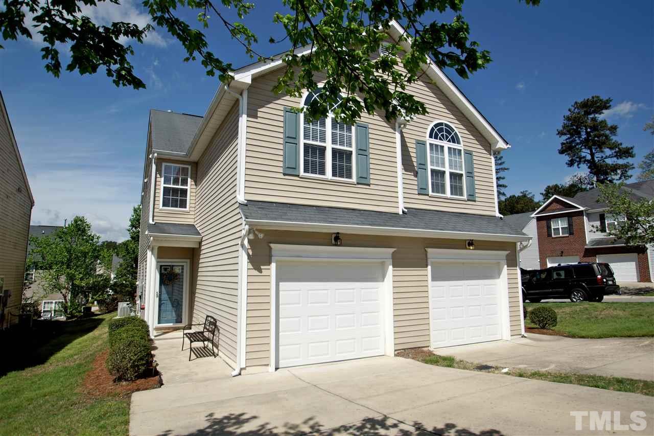 2161 Metacomet Way Raleigh, NC 27604 - Photo 1 of 21 a front view of a house with a yard and garage