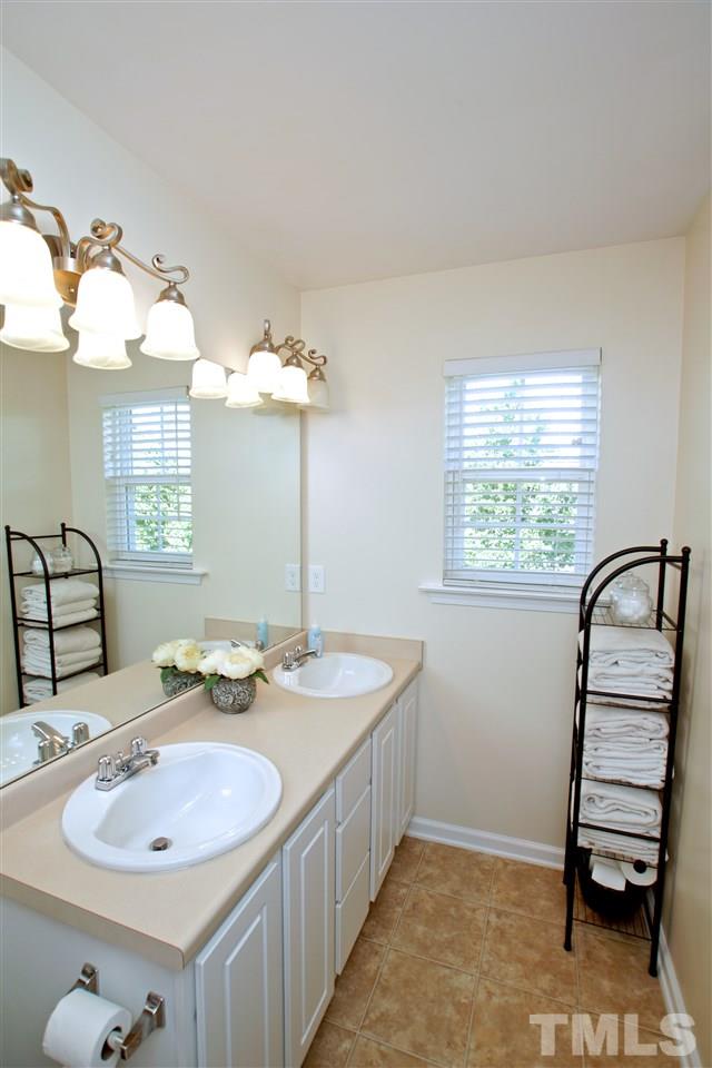 2161 Metacomet Way Raleigh, NC 27604 - Photo 13 of 21 a bathroom with a sink and a mirror