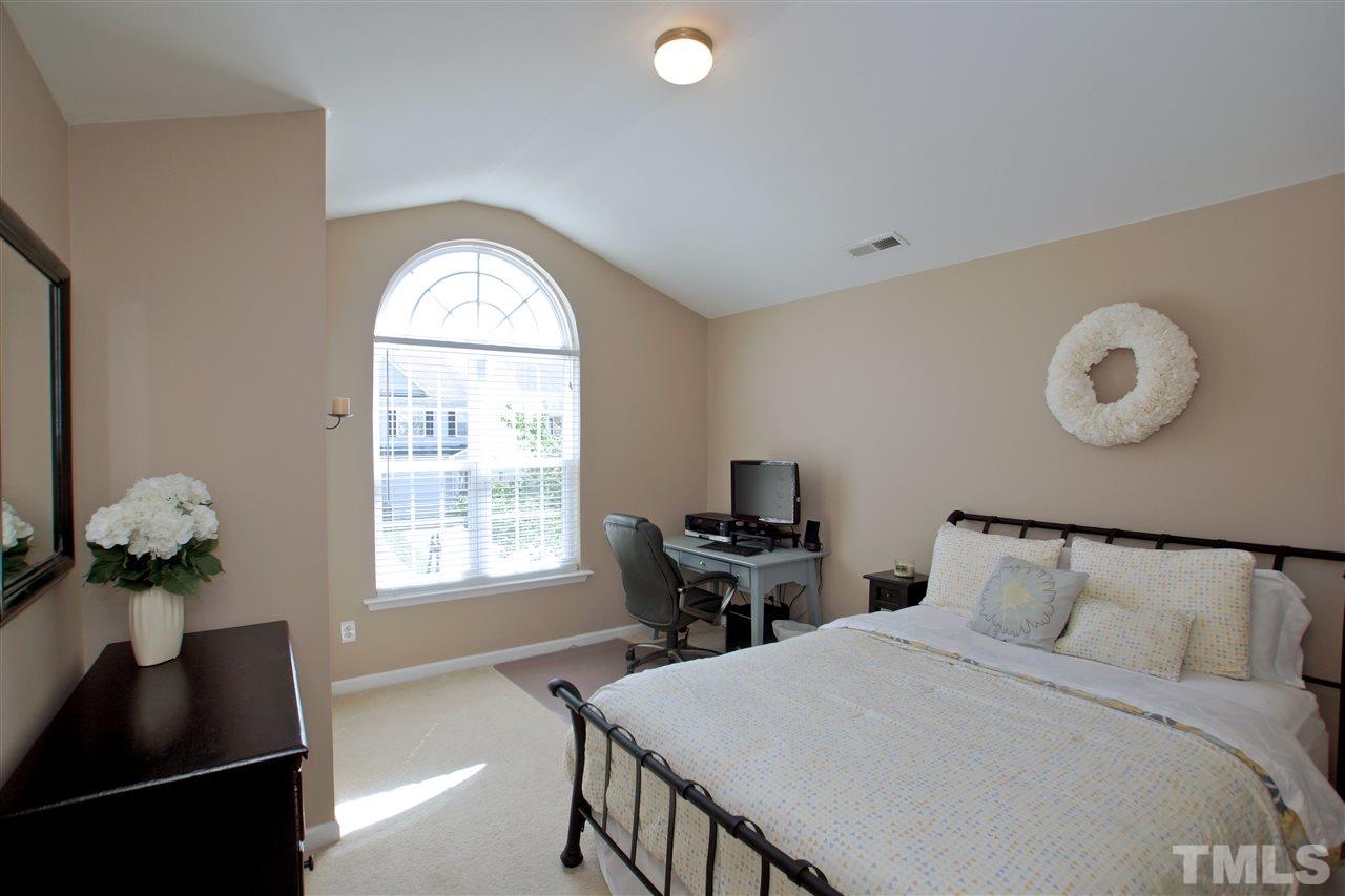 2161 Metacomet Way Raleigh, NC 27604 - Photo 15 of 21 a bedroom with a bed and a window