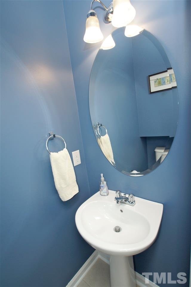 2161 Metacomet Way Raleigh, NC 27604 - Photo 20 of 21 a bathroom with a sink and a mirror