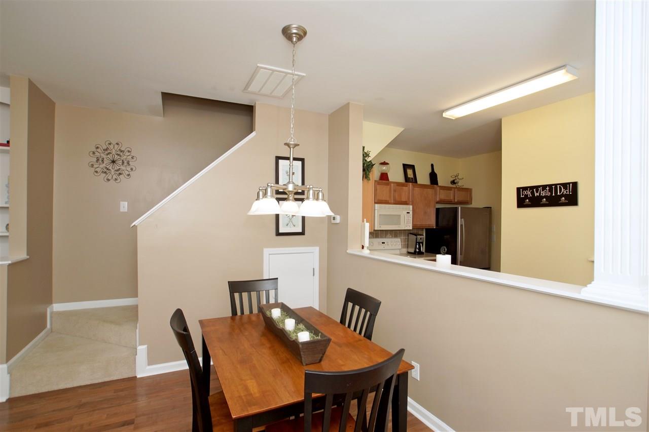 2161 Metacomet Way Raleigh, NC 27604 - Photo 6 of 21 a view of a dining room with furniture and wooden floor