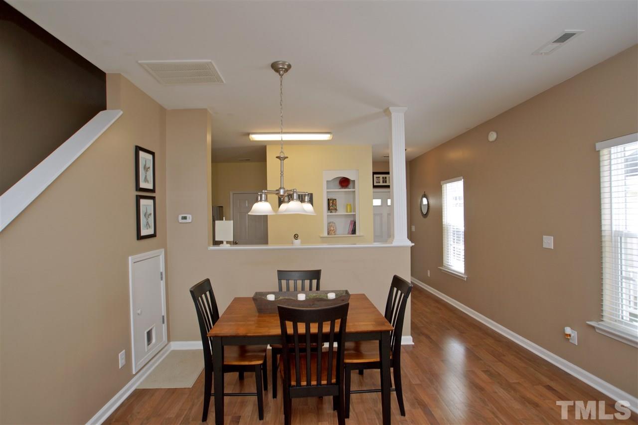 2161 Metacomet Way Raleigh, NC 27604 - Photo 7 of 21 a view of a dining room with furniture and wooden floor